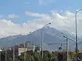Вид на Большой Алматинский пик с перекрестка улиц Саина-Шаляпина (30 сентября 2014 года)