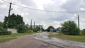 вид со стороны Трудовой улицына заднем плане предприятие «Млибор»